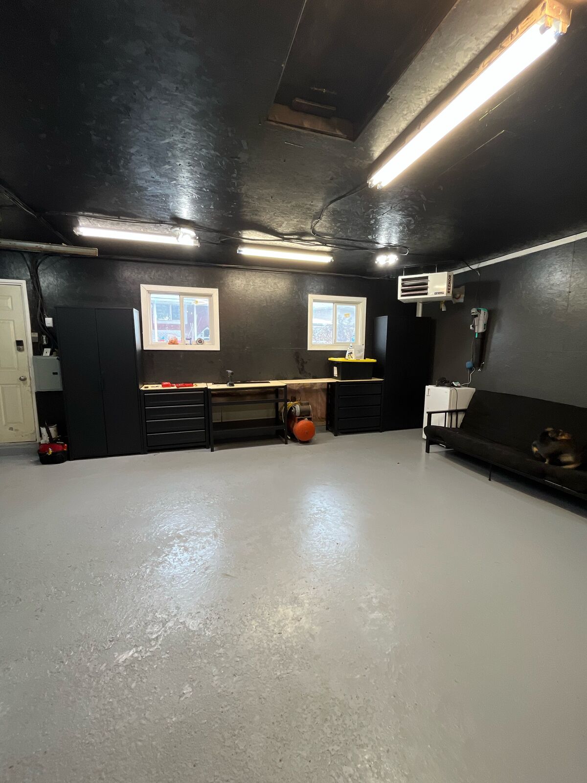 Organized Calgary garage workshop with clear floor and tool zones